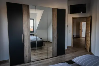 Ein Bett oder Betten in einem Zimmer der Unterkunft Landhaus Ferienwohnungen mit Pool und Wellness