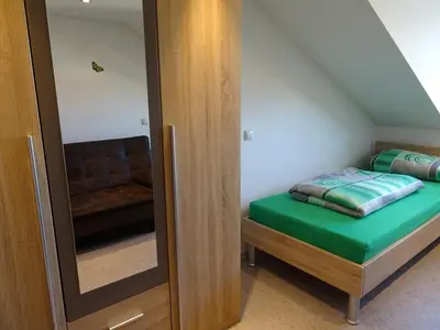 Ein Bett oder Betten in einem Zimmer der Unterkunft Ferienwohnung Hornauer