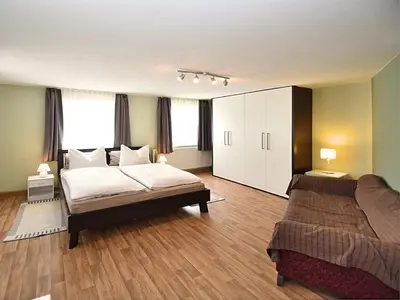 Ein Bett oder Betten in einem Zimmer der Unterkunft Ferienhaus mit Garten in Waldnähe