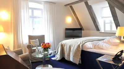 Ein Bett oder Betten in einem Zimmer der Unterkunft Schlosshotel Betzenstein