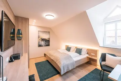 Ein Bett oder Betten in einem Zimmer der Unterkunft Der Heindlhof