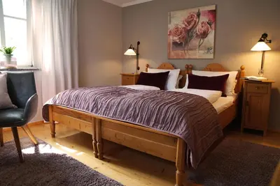 Ein Bett oder Betten in einem Zimmer der Unterkunft Der Heindlhof