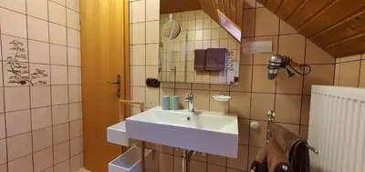 Ein Badezimmer in der Unterkunft Hotel / Pension Wolf