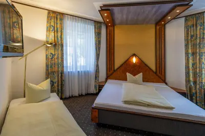 Ein Bett oder Betten in einem Zimmer der Unterkunft Bruckmayers Gästehaus