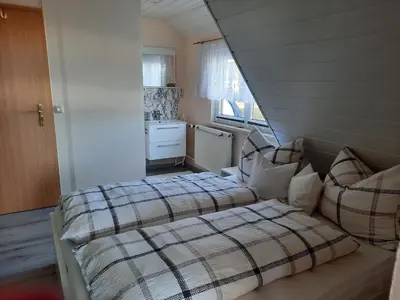 Ein Bett oder Betten in einem Zimmer der Unterkunft Ferienwohnungen Dagmar