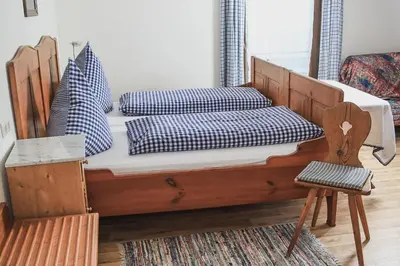 Ein Bett oder Betten in einem Zimmer der Unterkunft Gasthof Kornbachtal
