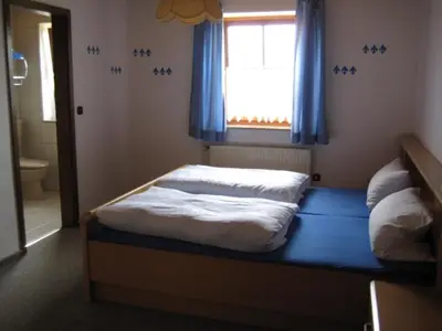 Ein Bett oder Betten in einem Zimmer der Unterkunft Ferienwohnungen Haberberger