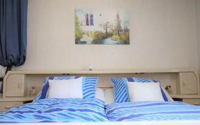 Ein Bett oder Betten in einem Zimmer der Unterkunft Ferienwohnung Röhrer