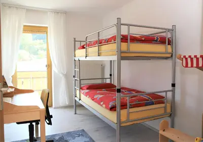 Ein Bett oder Betten in einem Zimmer der Unterkunft Ferienwohnung Röhrer
