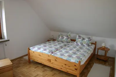 Ein Bett oder Betten in einem Zimmer der Unterkunft Ferienwohnung Trommler
