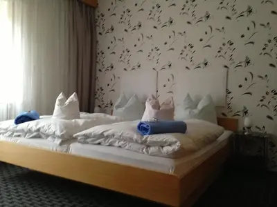 Ein Bett oder Betten in einem Zimmer der Unterkunft Pottensteiner Stuben Pension Gasthof