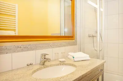 Ein Badezimmer in der Unterkunft Hotel Wilder Mann