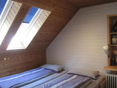 Ein Bett oder Betten in einem Zimmer der Unterkunft Ferienwohnungen Blätterrausch