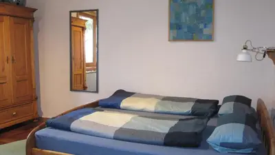 Ein Bett oder Betten in einem Zimmer der Unterkunft Ferienwohnungen Blätterrausch