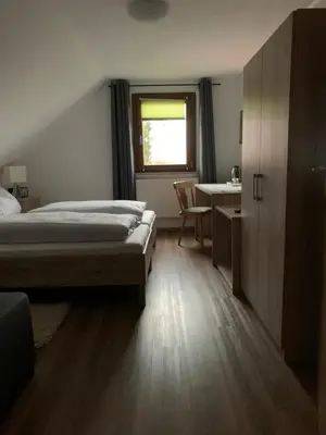 Ein Bett oder Betten in einem Zimmer der Unterkunft Hohe Tanne