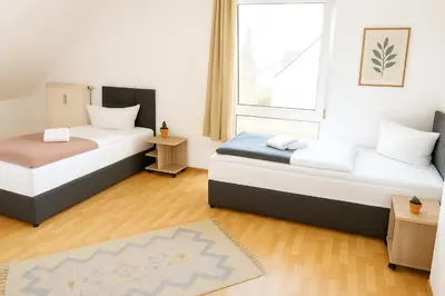 Ein Bett oder Betten in einem Zimmer der Unterkunft SUNNYHOME Monteurwohnungen und Apartments in Schwandorf