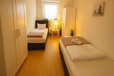 Ein Bett oder Betten in einem Zimmer der Unterkunft SUNNYHOME Monteurwohnungen und Apartments in Schwandorf