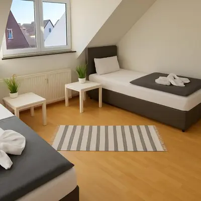 Ein Bett oder Betten in einem Zimmer der Unterkunft SUNNYHOME Monteurwohnungen und Apartments in Schwandorf
