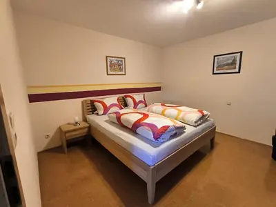 Ein Bett oder Betten in einem Zimmer der Unterkunft Ferienhaus Brütting
