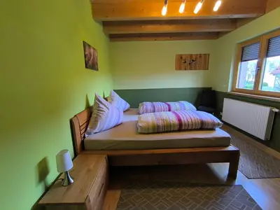 Ein Bett oder Betten in einem Zimmer der Unterkunft Ferienhaus Brütting