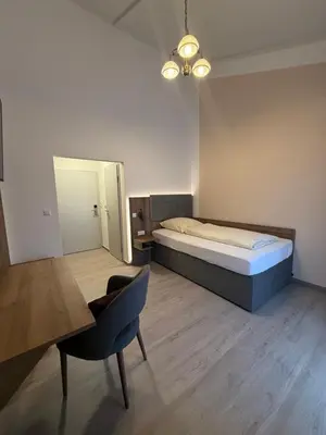 Ein Bett oder Betten in einem Zimmer der Unterkunft Zur Post Wellness und Sporthotel