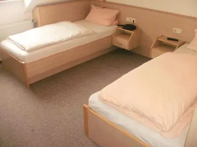 Ein Bett oder Betten in einem Zimmer der Unterkunft Zur Post Wellness und Sporthotel