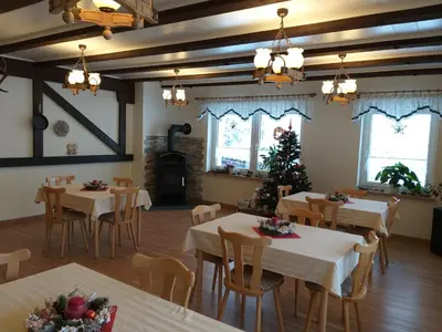 Ein Restaurant oder anderes Speiselokal in der Unterkunft Pension Berghof