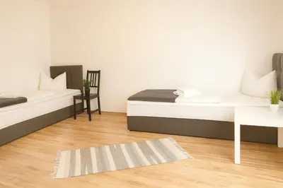 Ein Bett oder Betten in einem Zimmer der Unterkunft SUNNYHOME Monteurwohnungen und Apartments in Bodenwöhr
