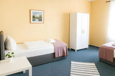 Ein Bett oder Betten in einem Zimmer der Unterkunft SUNNYHOME Monteurwohnungen und Apartments in Bodenwöhr