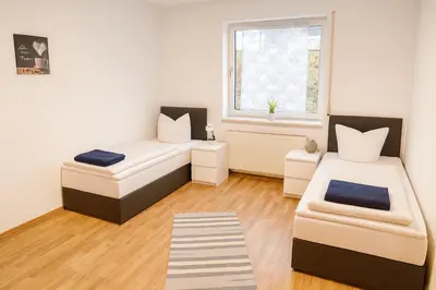 Ein Bett oder Betten in einem Zimmer der Unterkunft SUNNYHOME Monteurwohnungen und Apartments in Bodenwöhr