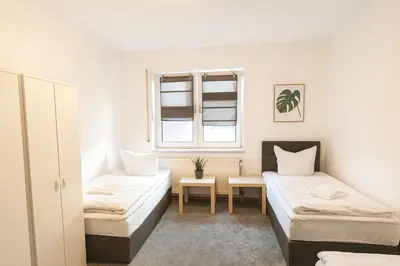 Ein Bett oder Betten in einem Zimmer der Unterkunft SUNNYHOME Monteurwohnungen und Apartments in Bodenwöhr