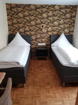 Ein Bett oder Betten in einem Zimmer der Unterkunft Boardinghouse Stadtmauer