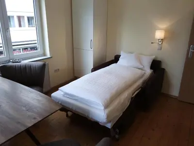 Ein Bett oder Betten in einem Zimmer der Unterkunft Boardinghouse Stadtmauer