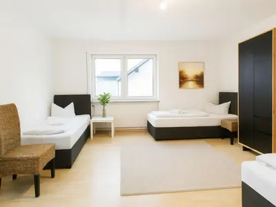 Ein Bett oder Betten in einem Zimmer der Unterkunft SUNNYHOME Monteurwohnungen und Apartments in Schwandorf