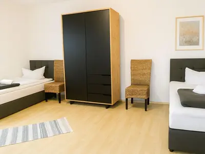 Ein Bett oder Betten in einem Zimmer der Unterkunft SUNNYHOME Monteurwohnungen und Apartments in Schwandorf