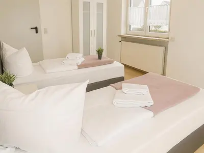 Ein Bett oder Betten in einem Zimmer der Unterkunft SUNNYHOME Monteurwohnungen und Apartments in Schwandorf