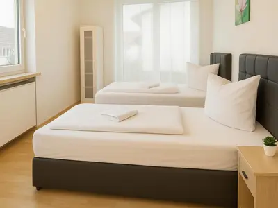 Ein Bett oder Betten in einem Zimmer der Unterkunft SUNNYHOME Monteurwohnungen und Apartments in Schwandorf
