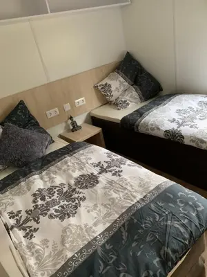 Ein Bett oder Betten in einem Zimmer der Unterkunft Mobilheim Murnersee Haus 5