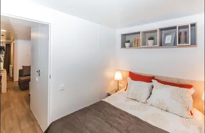 Ein Bett oder Betten in einem Zimmer der Unterkunft Mobilheim Murnersee Haus 5