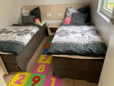 Ein Bett oder Betten in einem Zimmer der Unterkunft Mobilheim Murnersee Haus 5