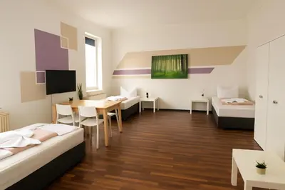 Ein Bett oder Betten in einem Zimmer der Unterkunft SUNNYHOME Monteurwohnungen und Apartments in Schwandorf