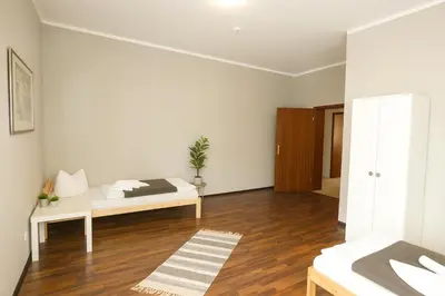 Ein Bett oder Betten in einem Zimmer der Unterkunft SUNNYHOME Monteurwohnungen und Apartments in Schwandorf