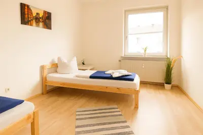 Ein Bett oder Betten in einem Zimmer der Unterkunft SUNNYHOME Monteurwohnungen und Apartments in Schwandorf