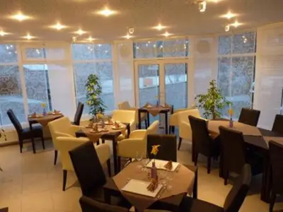Ein Sitzbereich in der Unterkunft Cafe und Pension Ringer