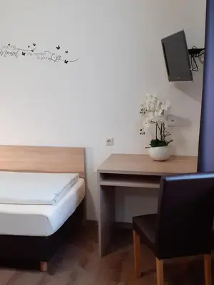 Ein Bett oder Betten in einem Zimmer der Unterkunft Hotel Promenade