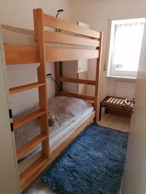 Ein Bett oder Betten in einem Zimmer der Unterkunft Haus 6