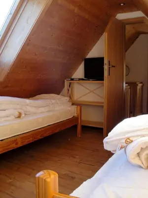 Ein Bett oder Betten in einem Zimmer der Unterkunft Ferienhaus Bergtraum – Ferienwohnung Lilli