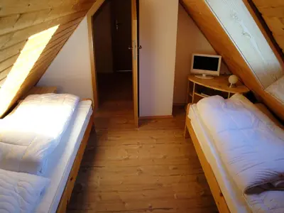 Ein Bett oder Betten in einem Zimmer der Unterkunft Ferienhaus Bergtraum – Ferienwohnung Lilli