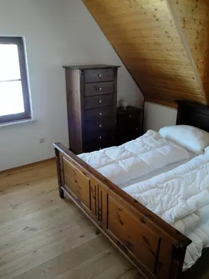 Ein Bett oder Betten in einem Zimmer der Unterkunft Ferienhaus Bergtraum – Ferienwohnung Lilli