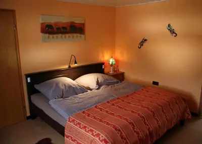 Ein Bett oder Betten in einem Zimmer der Unterkunft Ferienwohnung Frankenwald